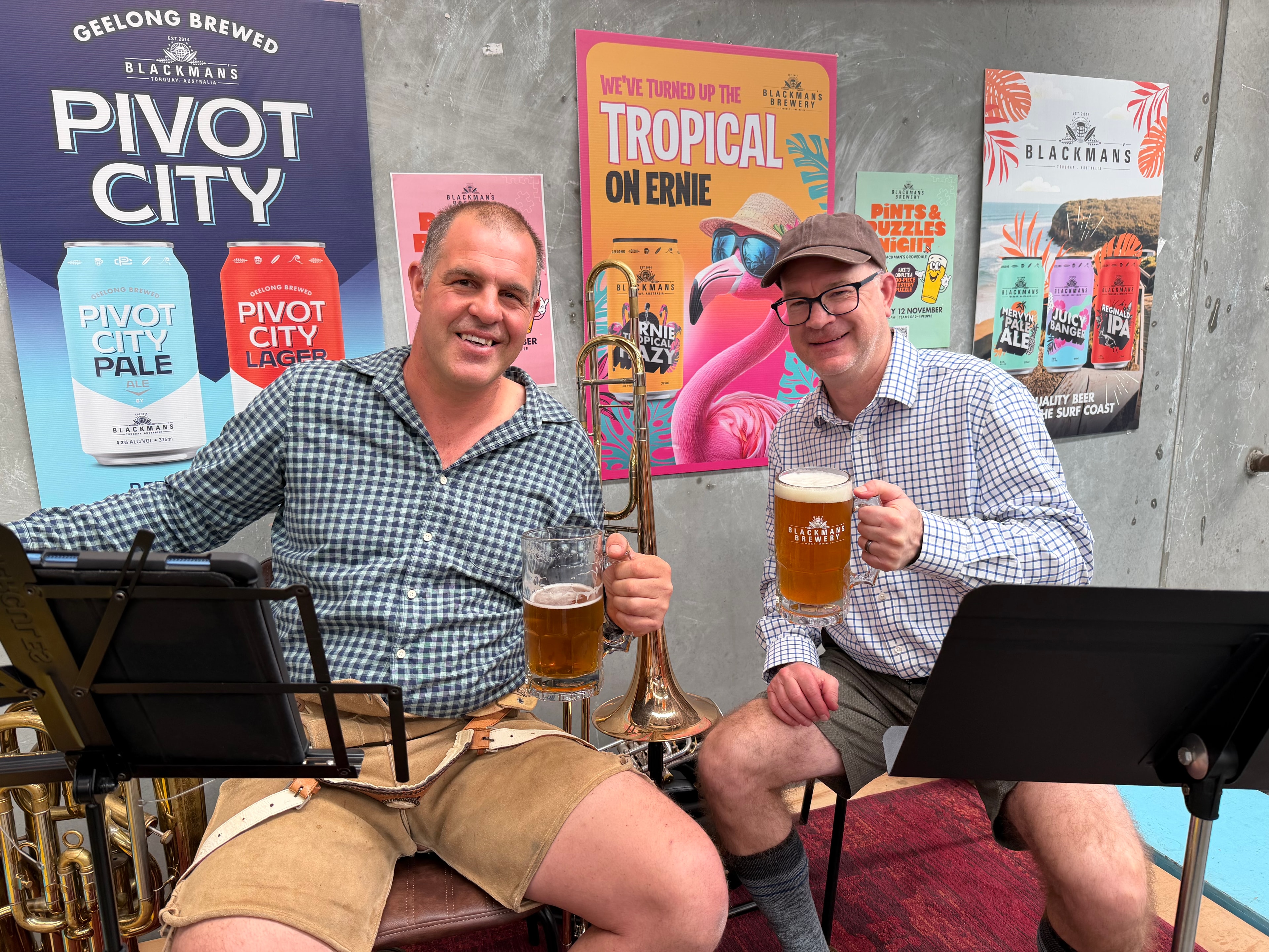 Two Geelong Brass musicians raising a glass at Blackmans Brewery